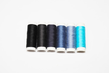 spools of thread isolated on white background