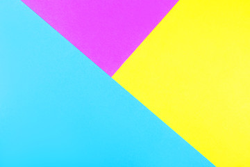 Creative geometric neon paper background. Blue, magenta and yellow colors.