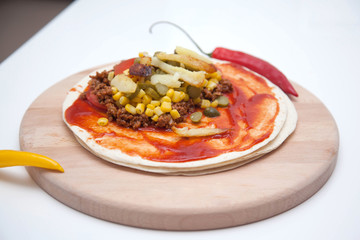 Delicious tortillas on kitchen table