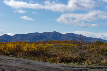 The natural landscape with a country road. Kamchatka, Russia.