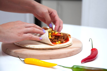 Delicious tortillas on kitchen table