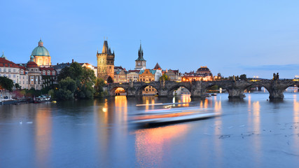 Charles Bridge (Czech: Karlův most) on Vltava river in the evening. Old Town Bridge Tower (Czech: Staroměstská mostecká věž). Prague, Czech Republic.