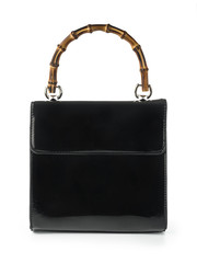 Leather handbag with wooden handles isolated on white background