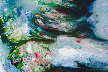 Abstract Oil color paint splatter on ground.