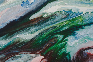 Abstract Oil color paint splatter on ground.