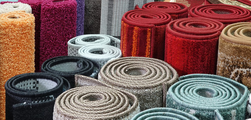 Carpets variety selection rolled up rugs shop store