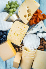 assorted cheeses, soft, hard, rennet and brine with fruits, nuts and dried fruits