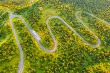 Aerial view of winding road on mountain in Autumn
