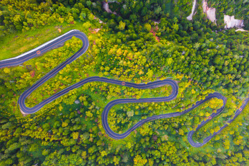 Aerial view of winding road on mountain in Autumn