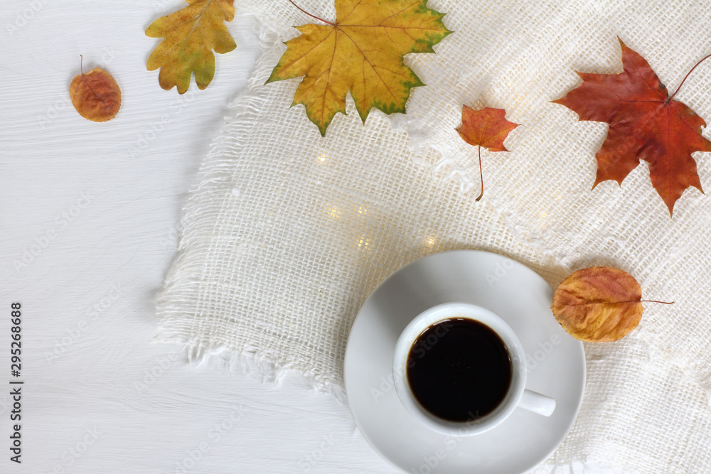 Wall mural cup of black coffee on the festive table top view. little break on autumn weekend