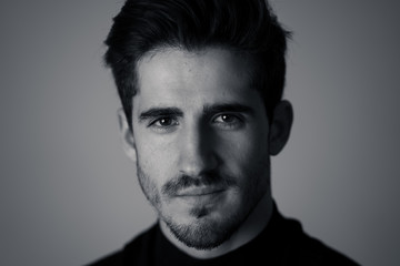 Young attractive latin man posing looking sensual and handsome. Beauty concept and lifestyle