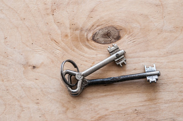 bunch of old keys on wooden background