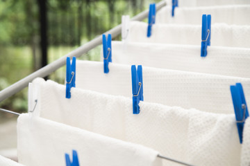 White towels drying on clotheshorse