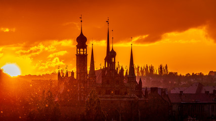 Naklejka premium The cityscape with churches at sunset