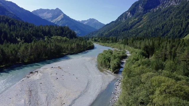 droneflight (aerial view) over river Lech in the valley Lechtal in Alps, Tirol, Austria, shot on a sunny summer day