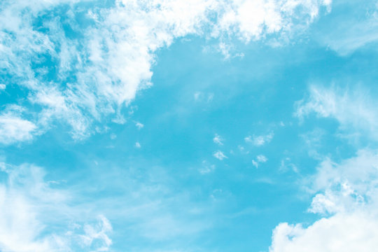 Bright clouds with wind pattern and copy space on blue sky background