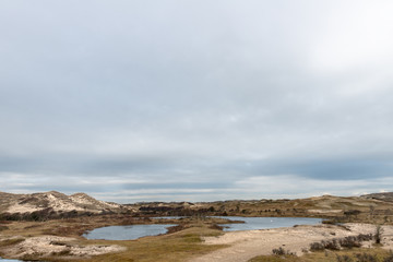 Panoramic view on a dunevalley with ponds