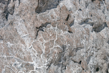 Salt crystals on the salty surface of desert close up. Natural background with copy space