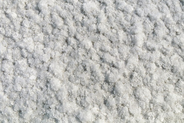 Salt crystals on the salty surface of desert close up. Natural background with copy space