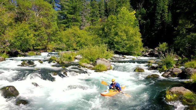 Aerial view of man whitewater kayaking the Mill Creek section of water on the upper Rogue River in Southern Oregon