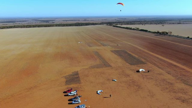 Paramotor flying above the wide Granite Field,South Australia