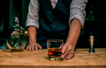 Barman pouring whiskey whiskey glass beautiful night