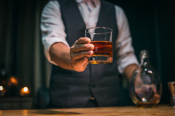 man with glass of whiskey