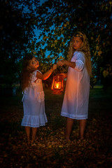 children frolic and shine wind lamps in the fall