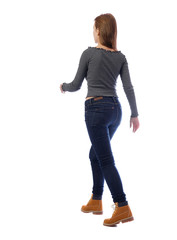 back view of walking woman.