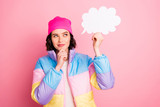 Photo of amazing minded lady tricky look on paper list in hand wear warm colored coat isolated pink background