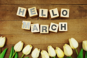 Hello March alphabet letters on wooden background