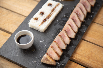 Tuna sirloin with peppers and rice