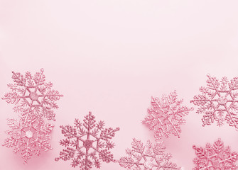 Festive winter background with decorative snowflakes in flying. Christmas, Winter or New Year concept with snowflakes. Flat lay