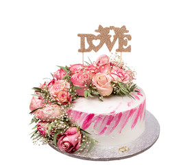 Wedding cake with the word love. On white background.