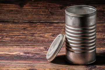 An aluminum can on wooden background