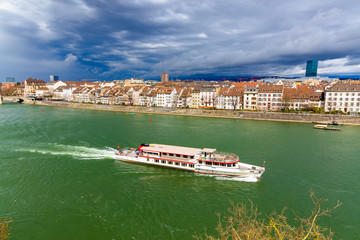 Fototapeta premium The ferry follows the Rhine River in the city of Basel, Switzerland