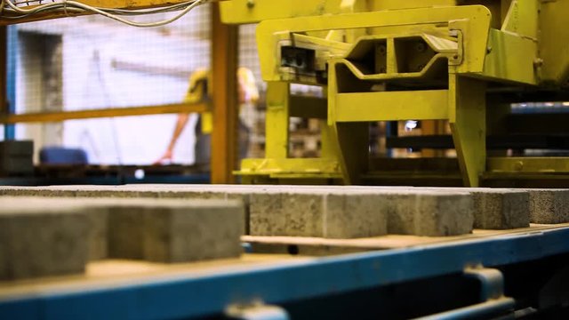Production Line Inside A Road Pavement Factory. Interlocked Pavement Blocks