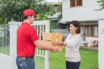 Asian delivery man deliver box parcel package to customer at home, shipping delivery concept