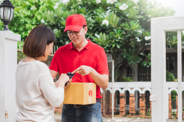 Asian delivery man deliver box parcel package to customer at home, shipping delivery concept