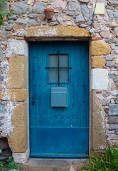 Beautiful rustic blue door in Spain.