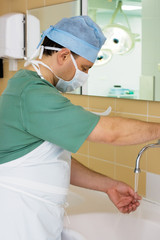 Surgeon Washing his Hands in Operating Room