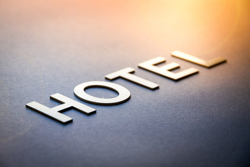 Word hotel written with white solid letters - obrazy, fototapety, plakaty