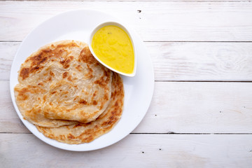 Roti canai or paratha with dhal