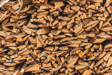 stacks of firewood. firewood for the winter, .dry chopped pile of firewood. wall of fire wood background.