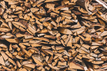 stacks of firewood. firewood for the winter, .dry chopped pile of firewood. wall of fire wood background.