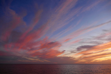 Sunset in Alghero, Sardinia, Italy. Colorful seascape on a summer night.