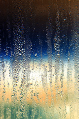Naklejka na ściany i meble Drops on glass as a background