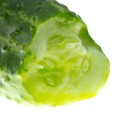 Detail of a green cucumber on a white background