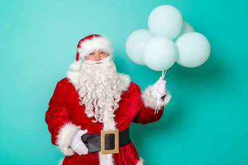 Santa Claus holding balloons