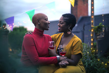 Loving couple celebrating on a terrace